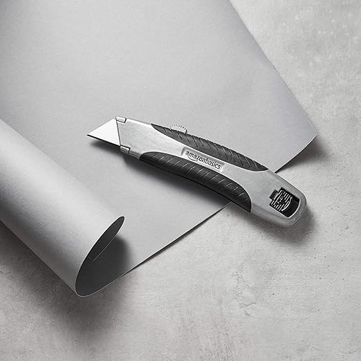 Amazon Basics Soft Grip Retractable Utility Knife with 3 Carbon Steel Blades, Quick Change Blade System, Black/Silver