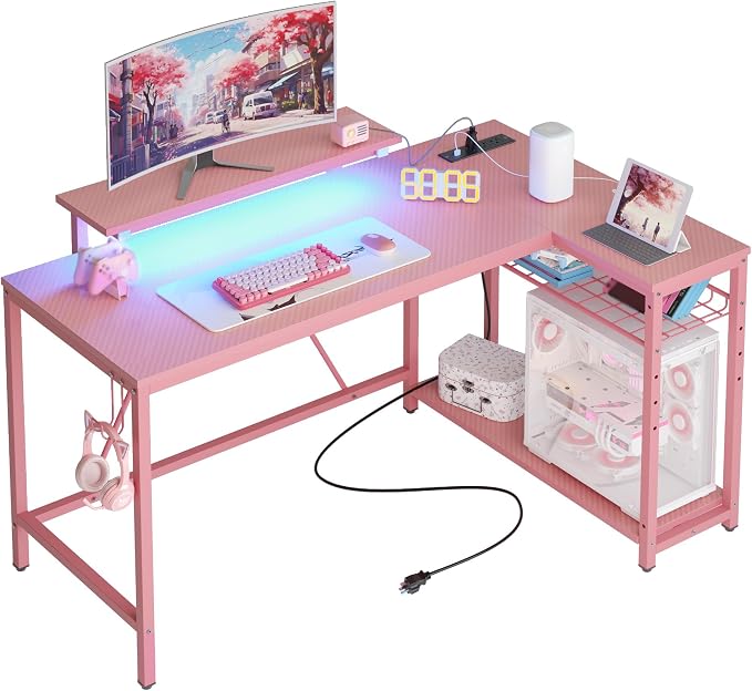 Bestier 52-Inch L-Shaped Gaming Desk with Charging & LED, Pink | Charging 3AC+2USB, RGB LED 20 Colors/22 Modes, Reversible Storage Shelves, Carbon Fiber Texture, Headphone Hook, 52 in