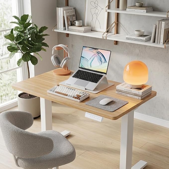 HUANUO 32x19 Inch Small Electric Standing Desk, Adjustable, Light Walnut | 176 Lbs Capacity, Rounded Corners, Wheel-Ready Feet, Compact Desktop, Apartment Workspace, 28.3–46.5 Inch Height Range