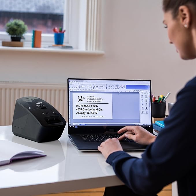 Brother QL-600 Desktop Monochrome Label Printer, up to 2.4" Label Width, No Ink Required, uses Genuine DK Drop-in Rolls for Fast Labeling and Easy Integration with Microsoft Applications