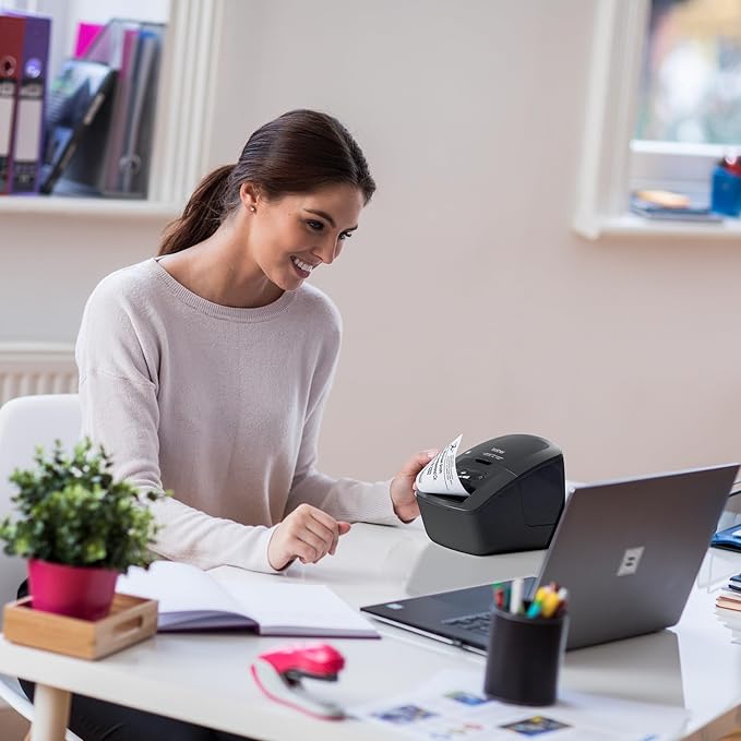 Brother QL-600 Desktop Monochrome Label Printer, up to 2.4" Label Width, No Ink Required, uses Genuine DK Drop-in Rolls for Fast Labeling and Easy Integration with Microsoft Applications
