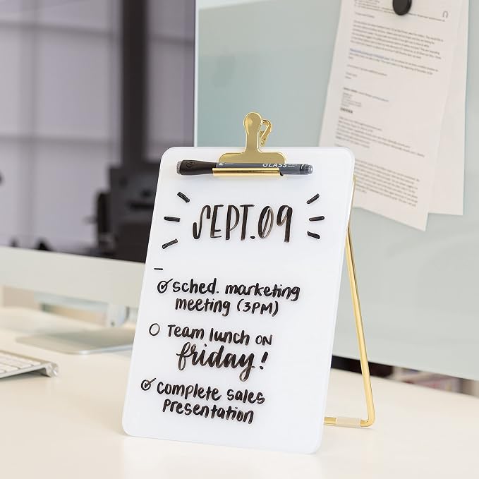 U Brands Desk Whiteboard Easel, Glass Dry Erase Board, Gold Wire Stand | A small white board and standing clipboard in one, with a marker whose cap is its own eraser and a clip that holds papers.